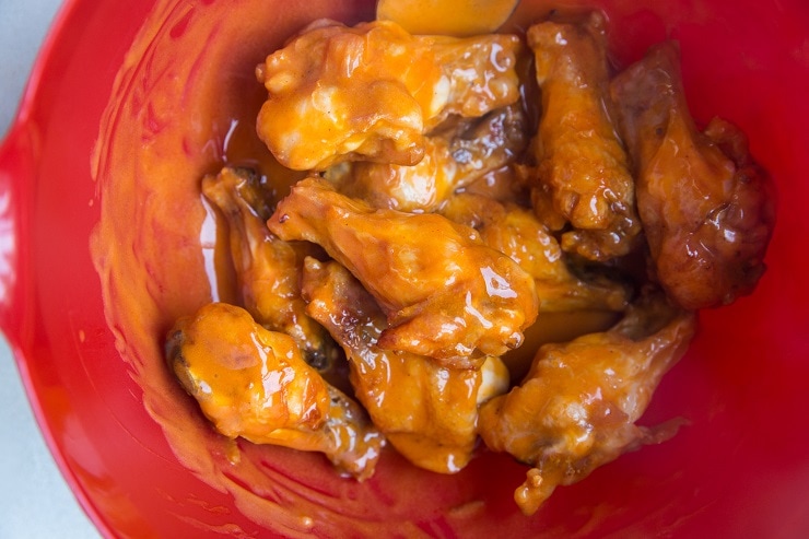 Toss the chicken in buffalo sauce until well-coated