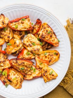 Air Fryer Cream Cheese Stuffed Mini Peppers - an easy low-carb keto appetizer recipe made lightning quick! An epic crowd pleaser of a bite!