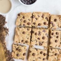 Flourless Tahini Chocolate Chip Cookie Bars made with just 6 basic ingredients are loaded with chocolaty flavor. Grain-free, refined sugar-free, dairy-free and so easy to make!