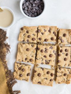 Flourless Tahini Chocolate Chip Cookie Bars made with just 6 basic ingredients are loaded with chocolaty flavor. Grain-free, refined sugar-free, dairy-free and so easy to make!
