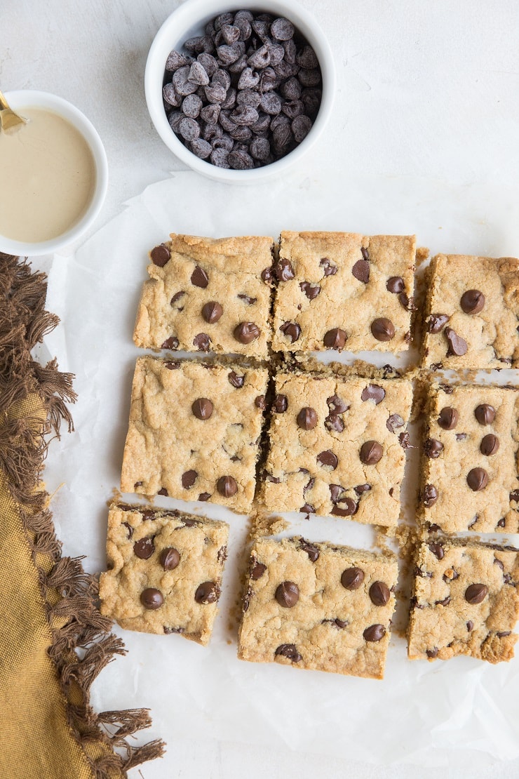 Flourless Tahini Chocolate Chip Cookie Bars made with just 6 basic ingredients are loaded with chocolaty flavor. Grain-free, refined sugar-free, dairy-free and so easy to make!