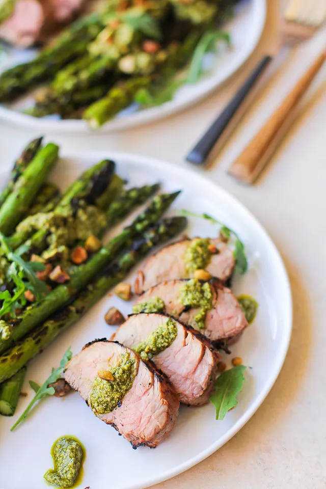 Easy Perfect Grilled Pork Tenderloin with an amazing marinade! Serve it up with grilled asparagus and pesto for an amazing meal
