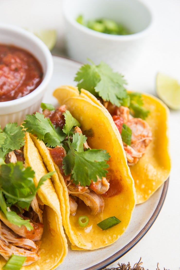 Shredded Chicken Tacos made in the Instant Pot. Perfectly tender and delicious made with 5 ingredients