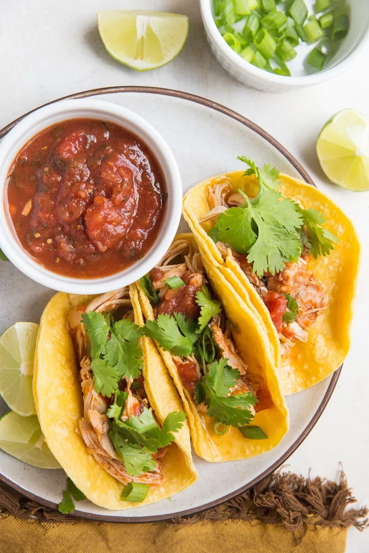 Shredded Chicken Tacos made quick and easy in the Instant Pot! Only 5 ingredients and 40 minutes is all you need