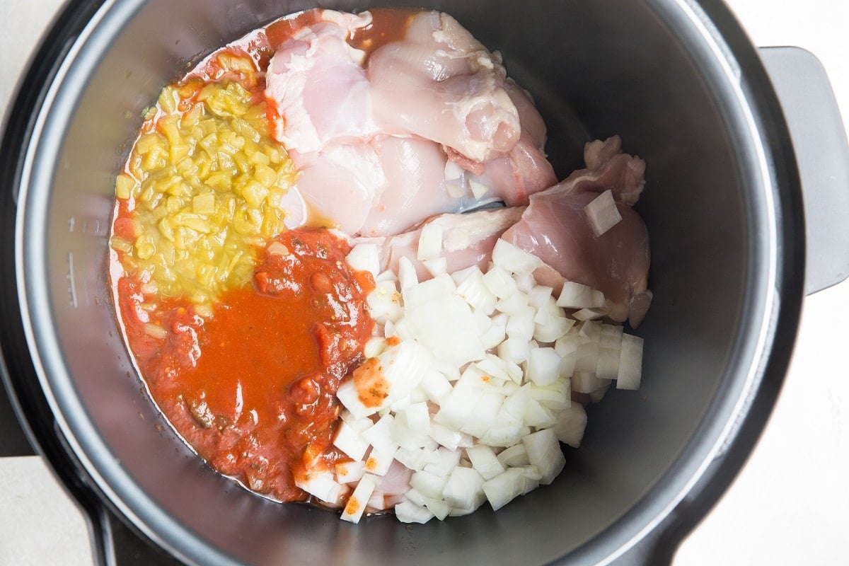 Add all ingredients for the chicken tacos to an instant pot