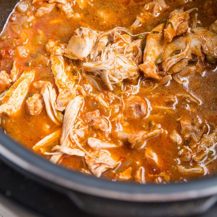 Instant Pot Mexican shredded chicken in a pressure cooker, ready to serve.
