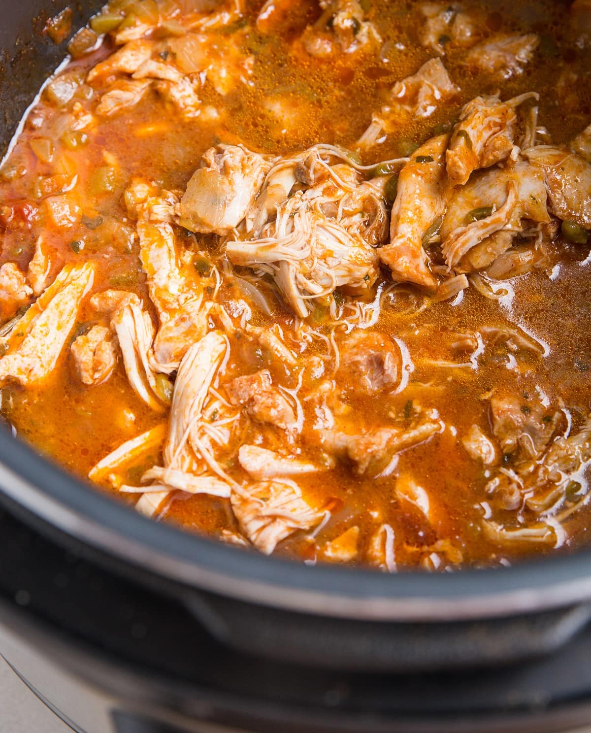 Instant Pot Mexican shredded chicken in a pressure cooker, ready to serve.