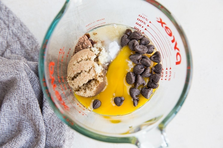 Ingredients for chocolate mug cake in a measuring cup