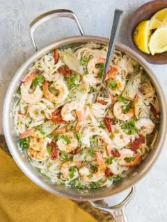 Easy Gluten-Free Mediterranean Shrimp Pasta with sun-dried tomatoes, artichoke hearts and capers in a lemon garlic cream sauce (that happens to be dairy-free)