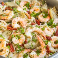 Gluten-Free Dairy-Free Mediterranean Shrimp Pasta with sun-dried tomatoes, artichoke hearts and capers in a lemon garlic cream sauce (that happens to be dairy-free)