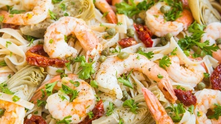 Gluten-Free Dairy-Free Mediterranean Shrimp Pasta with sun-dried tomatoes, artichoke hearts and capers in a lemon garlic cream sauce (that happens to be dairy-free)