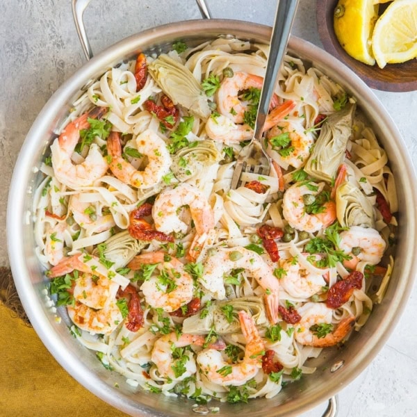 Easy Gluten-Free Mediterranean Shrimp Pasta with sun-dried tomatoes, artichoke hearts and capers in a lemon garlic cream sauce (that happens to be dairy-free)