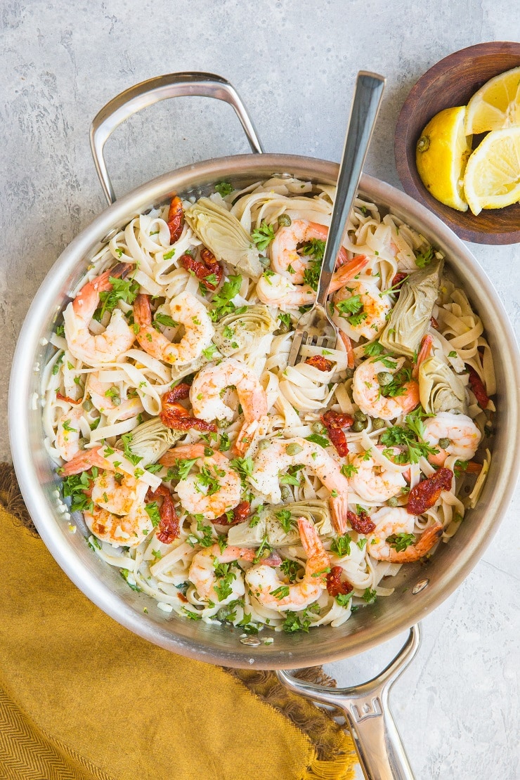 Easy Gluten-Free Mediterranean Shrimp Pasta with sun-dried tomatoes, artichoke hearts and capers in a lemon garlic cream sauce (that happens to be dairy-free)