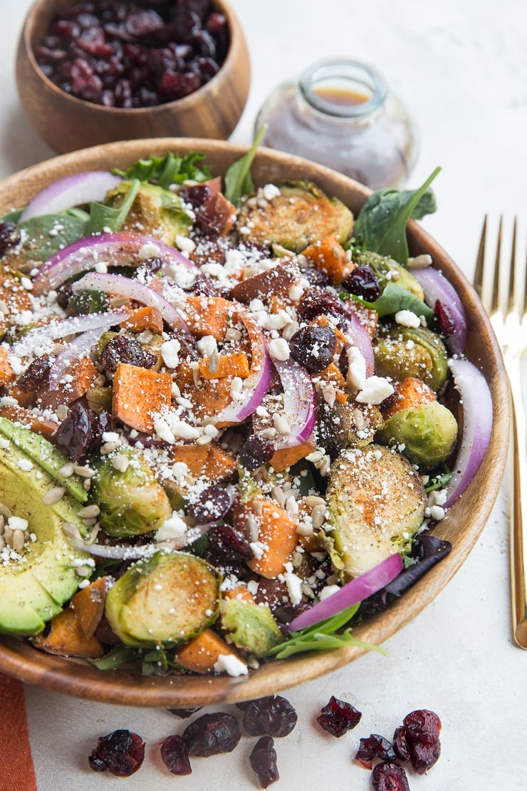 Roasted Sweet Potato and Brussel Sprout Salad with Cinnamon Balsamic Dressing is a nutritious fall-inspired salad