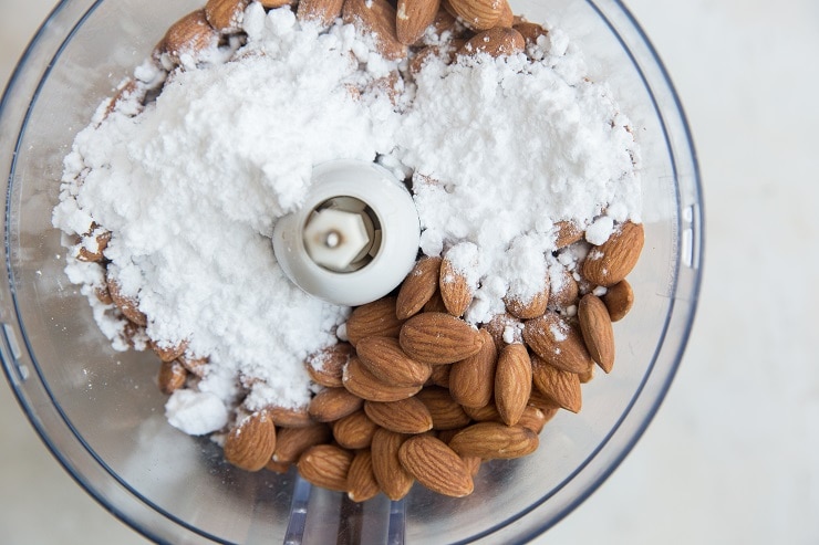 Add the almonds and sugar free sweetener to a food processor