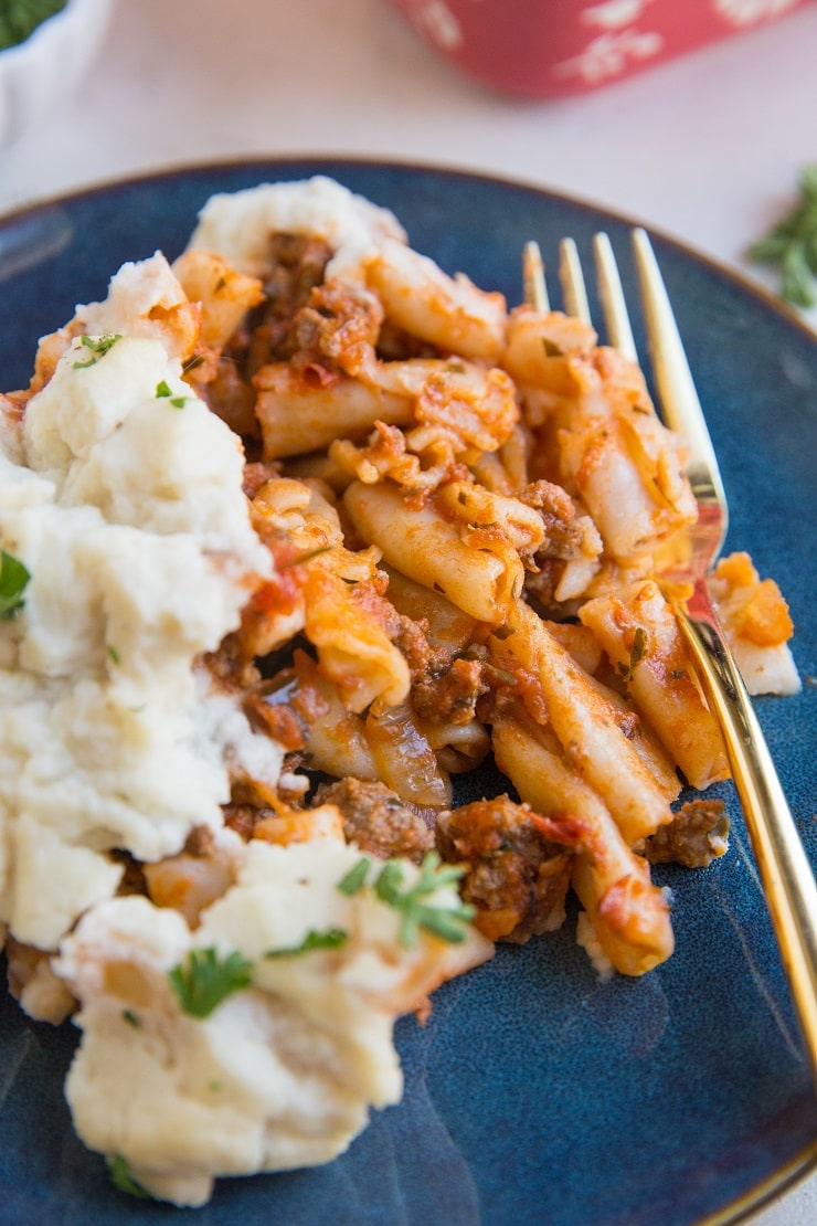 Gluten-Free Dairy-Free Baked Ziti made with gluten-free pasta noodles and a creamy cauliflower sauce instead of cheese.