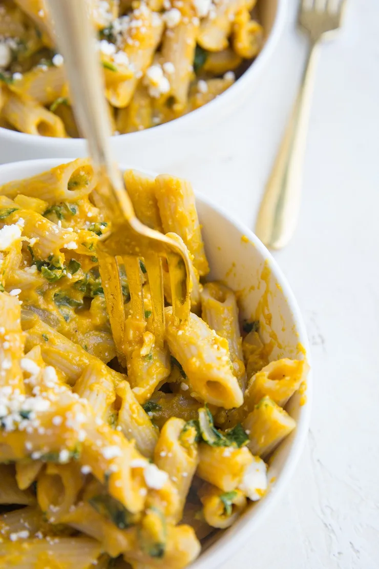 Gluten-Free Pumpkin Pasta with spinach and feta - ultra creamy yet light pasta recipe that is loaded with comforting fall flavors.