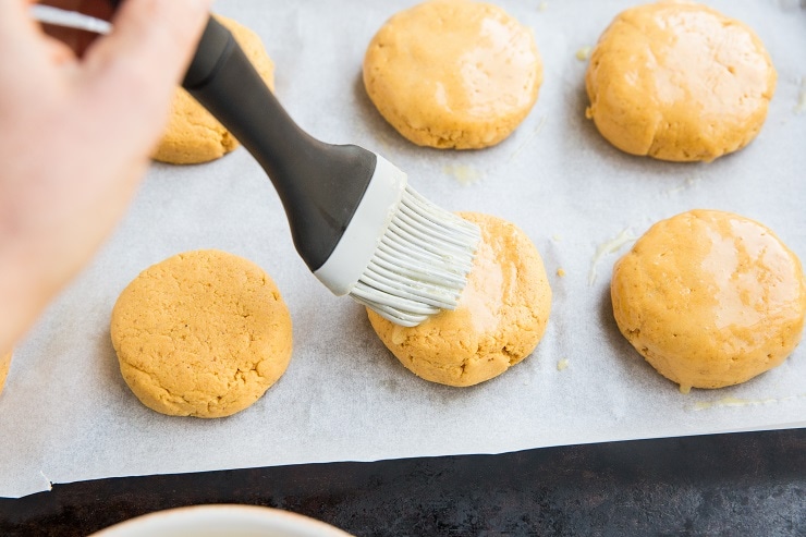 Brush egg wash over the biscuits