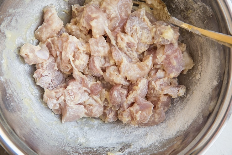 Chicken thighs coated in egg and flour