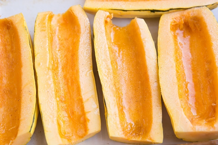 Drizzle the delicata squash with oil and sprinkle with salt