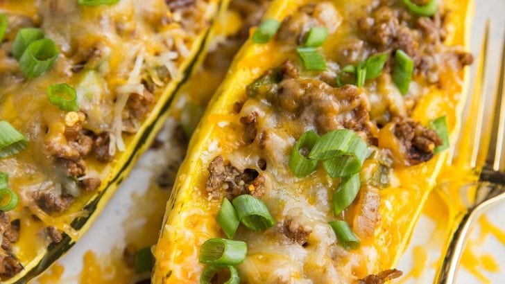 Taco Stuffed Delicata Squash with spiced ground beef, onion, and cheese. This simple, clean meal is nourishing, easy to prepare, and perfect for fall or winter!