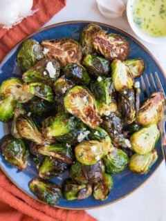 Air Fryer Garlic Butter Brussel Sprouts are easy to toss together any night of the week. The best golden-brown crispy, perfectly cooked brussels with tons of flavor!