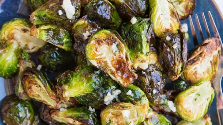Air Fryer Garlic Butter Brussel Sprouts are easy to toss together any night of the week. The best golden-brown crispy, perfectly cooked brussels with tons of flavor!
