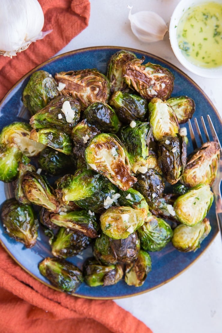 Air Fryer Garlic Butter Brussel Sprouts are easy to toss together any night of the week. The best golden-brown crispy, perfectly cooked brussels with tons of flavor!