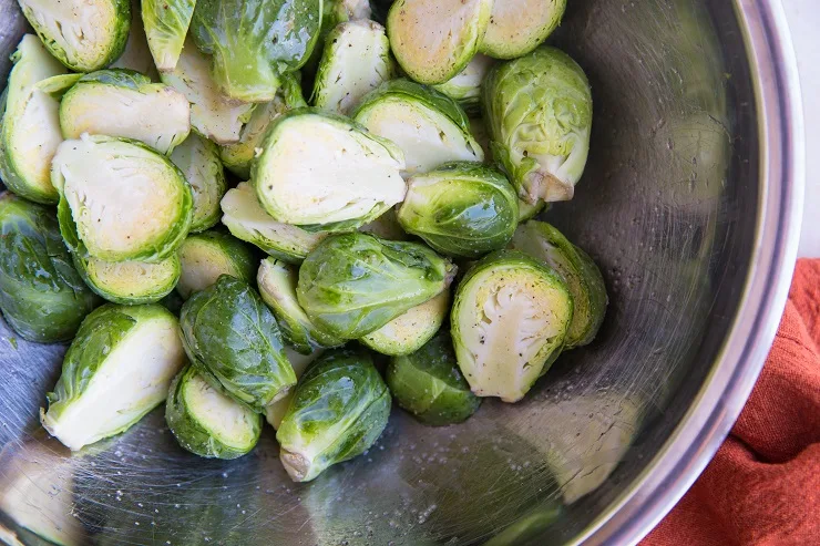 Toss the brussel sprouts in avocado oil and sea salt