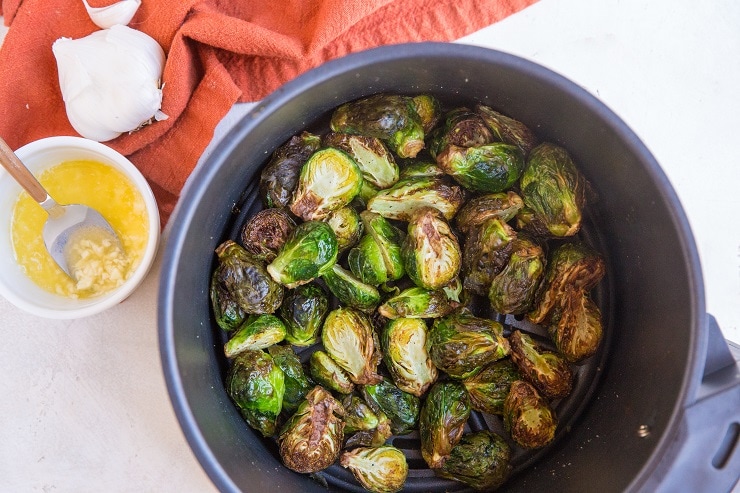 Toss the brussel sprouts in garlic butter