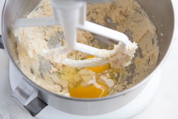 Add the eggs to the mixer