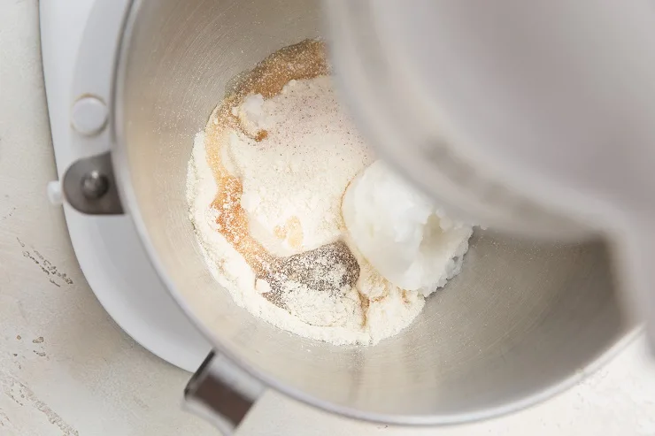 Add coconut flour, coconut oil and pure maple syrup to a stand mixer and beat