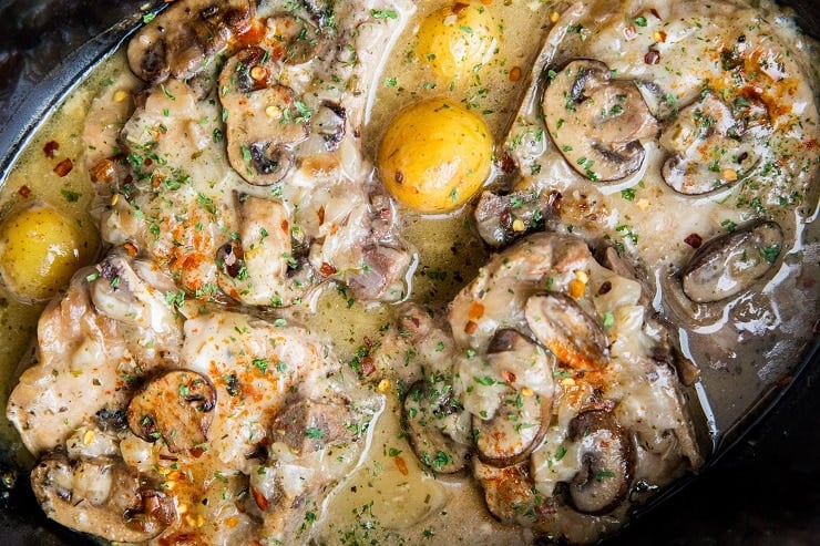 Slow Cooker Creamy Pork Chops with dairy-free sauce, potatoes, and mushrooms
