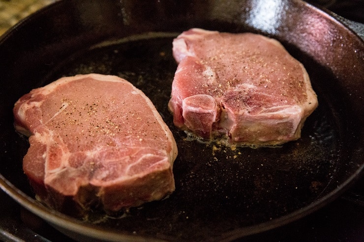 Sprinkle the pork chops with salt