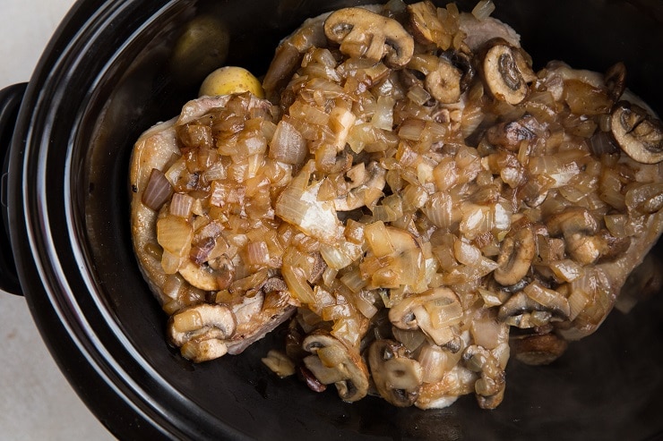 Transfer the sautéed onion and mushrooms on top