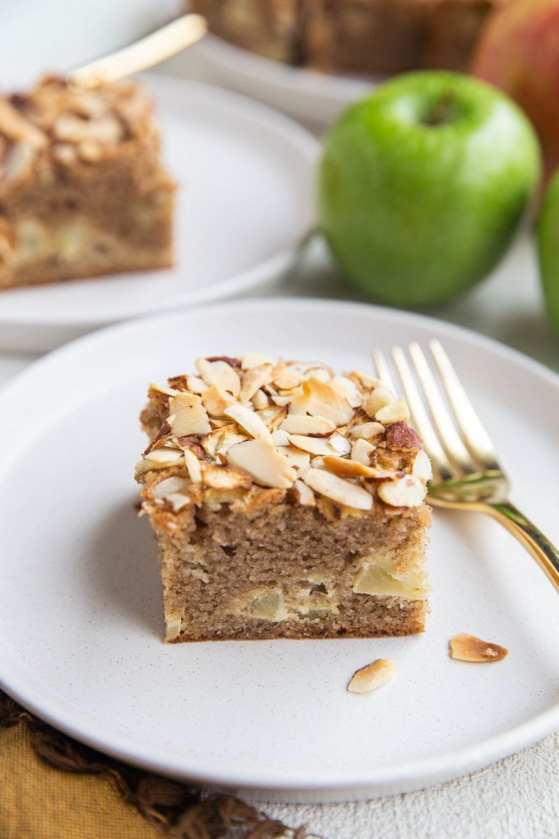 Close up apple cake slice on a white plate