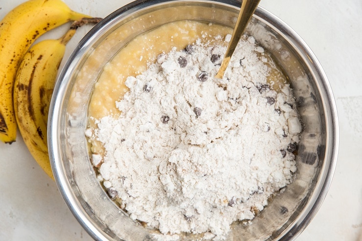 Pour the dry mixture into the bowl with the wet mixture