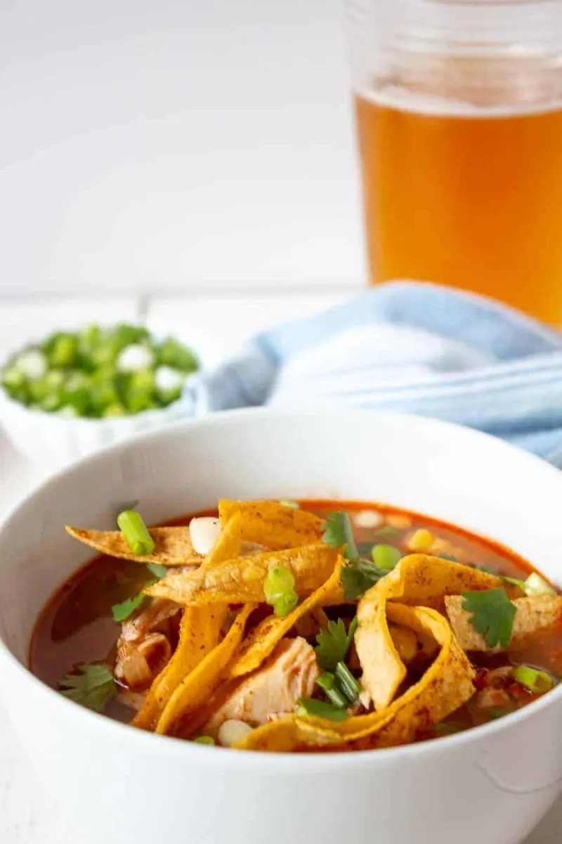 Turkey Tortilla Soup is a perfect use for leftover turkey! This delicious soup is filled with chunks of turkey, black beans and corn all in a rich broth.
