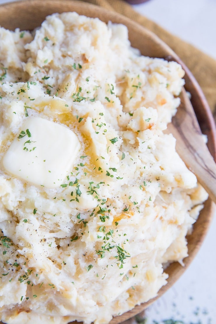 Roasted Garlic Buttermilk Mashed Potatoes with Parmesan are just brimming with flavor! The BEST Mashed Potatoes recipe right here!