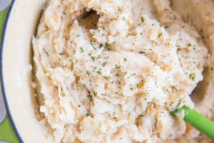 Incredibly flavorful Caramelized Onion and Roasted Garlic Mashed Potatoes with buttermilk and parmesan - an incredibly rich and delicious side dish!