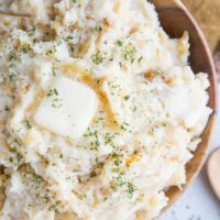 Creamy, luscious Caramelized Onion & Roasted Garlic Parmesan Mashed Potatoes with Buttermilk - an insanely creamy and flavorful mashed potatoes recipe