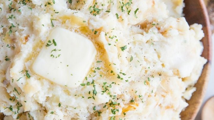 Creamy, luscious Caramelized Onion & Roasted Garlic Parmesan Mashed Potatoes with Buttermilk - an insanely creamy and flavorful mashed potatoes recipe