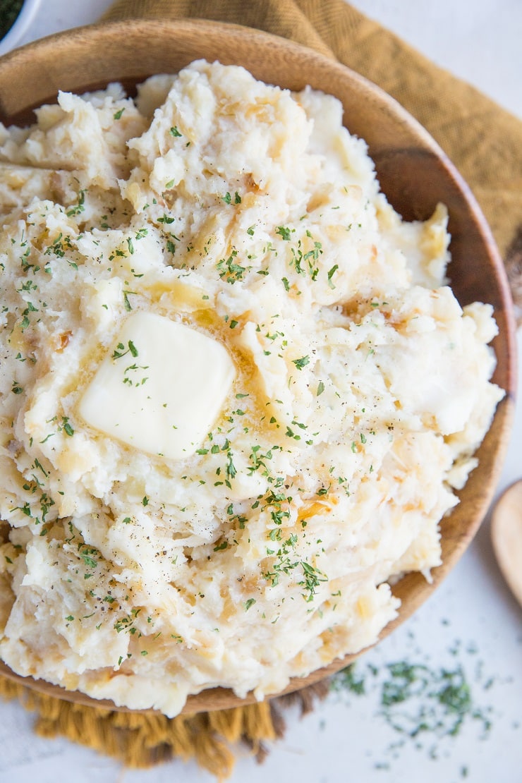 Creamy, luscious Caramelized Onion & Roasted Garlic Parmesan Mashed Potatoes with Buttermilk - an insanely creamy and flavorful mashed potatoes recipe