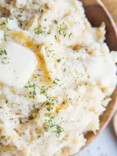 Caramelized Onion and Roasted Garlic Buttermilk Mashed Potatoes with Parmesan are just brimming with flavor! The BEST Mashed Potatoes recipe right here!