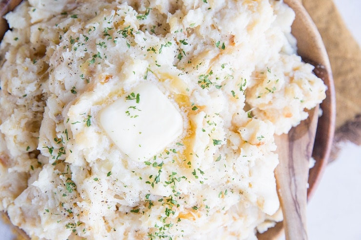 Caramelized Onion and Roasted Garlic Buttermilk Mashed Potatoes with Parmesan are just brimming with flavor! The BEST Mashed Potatoes recipe for a glorious side dish to any meal