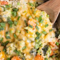 Cheesy Vegetable Brown Rice Casserole - Cheesy Vegetable and Brown Rice Casserole is here for all your side dish needs! This creamy, cheesy combination of rice and vegetables is a surefire way of getting kids to eat their veggies and is also just a marvelous delight to enjoy alongside your main dish.