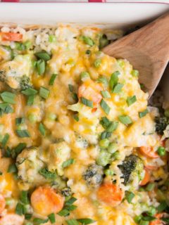 Cheesy Vegetable Brown Rice Casserole - Cheesy Vegetable and Brown Rice Casserole is here for all your side dish needs! This creamy, cheesy combination of rice and vegetables is a surefire way of getting kids to eat their veggies and is also just a marvelous delight to enjoy alongside your main dish.