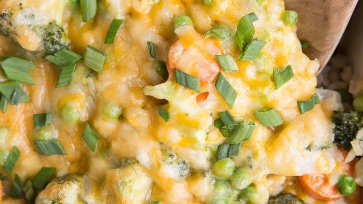 Cheesy Vegetable Brown Rice Casserole - Cheesy Vegetable and Brown Rice Casserole is here for all your side dish needs! This creamy, cheesy combination of rice and vegetables is a surefire way of getting kids to eat their veggies and is also just a marvelous delight to enjoy alongside your main dish.