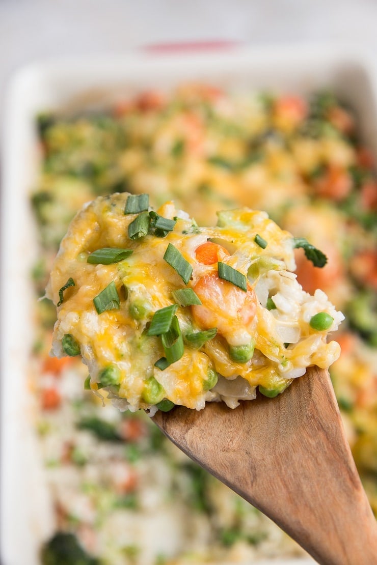 Cheesy Vegetable and Brown Rice Casserole is here for all your side dish needs! This creamy, cheesy combination of rice and vegetables is a surefire way of getting kids to eat their veggies and is also just a marvelous delight to enjoy alongside your main dish.