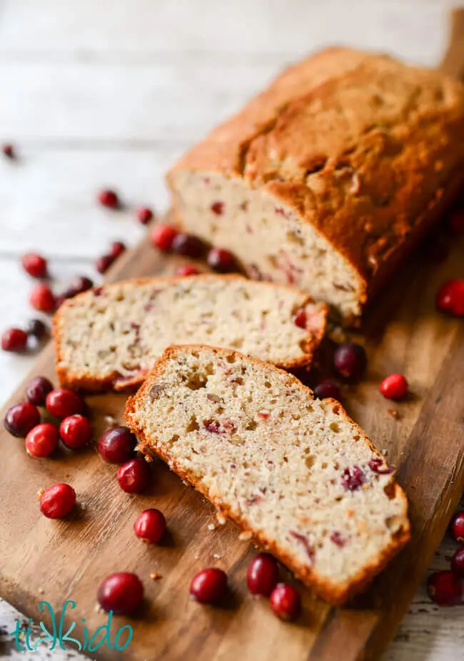 Cranberry nut bread is an easy holiday treat full of festive flavors.  And this cranberry quick bread recipe uses up leftover cranberry sauce. Replace the regular flour with gluten-free flour to make this bread GF.